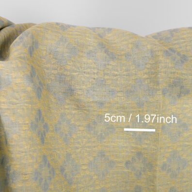 Gult floral linstoff for sying klær, hjemmetekstiler