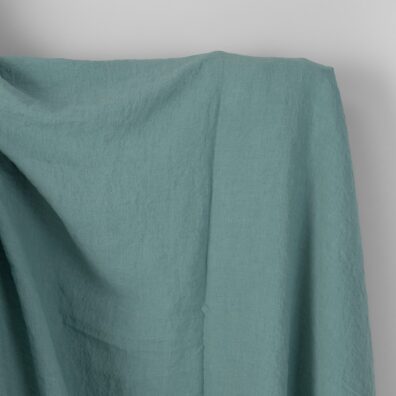 Linstoff akvamaringrønt bredt vasket