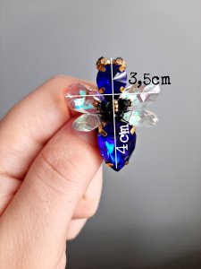 Raudona musytė sagė