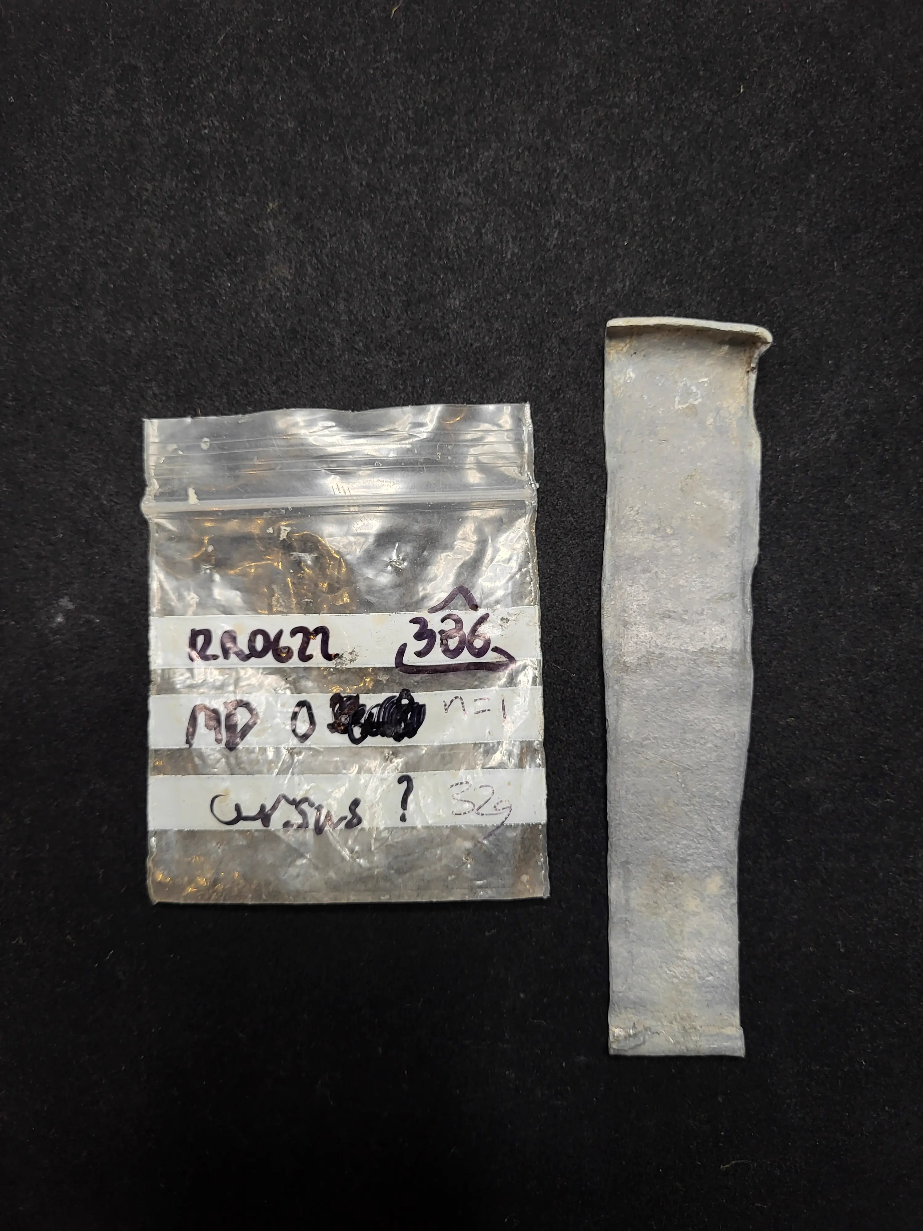 Rolled Roman lead curse tablet from Grove