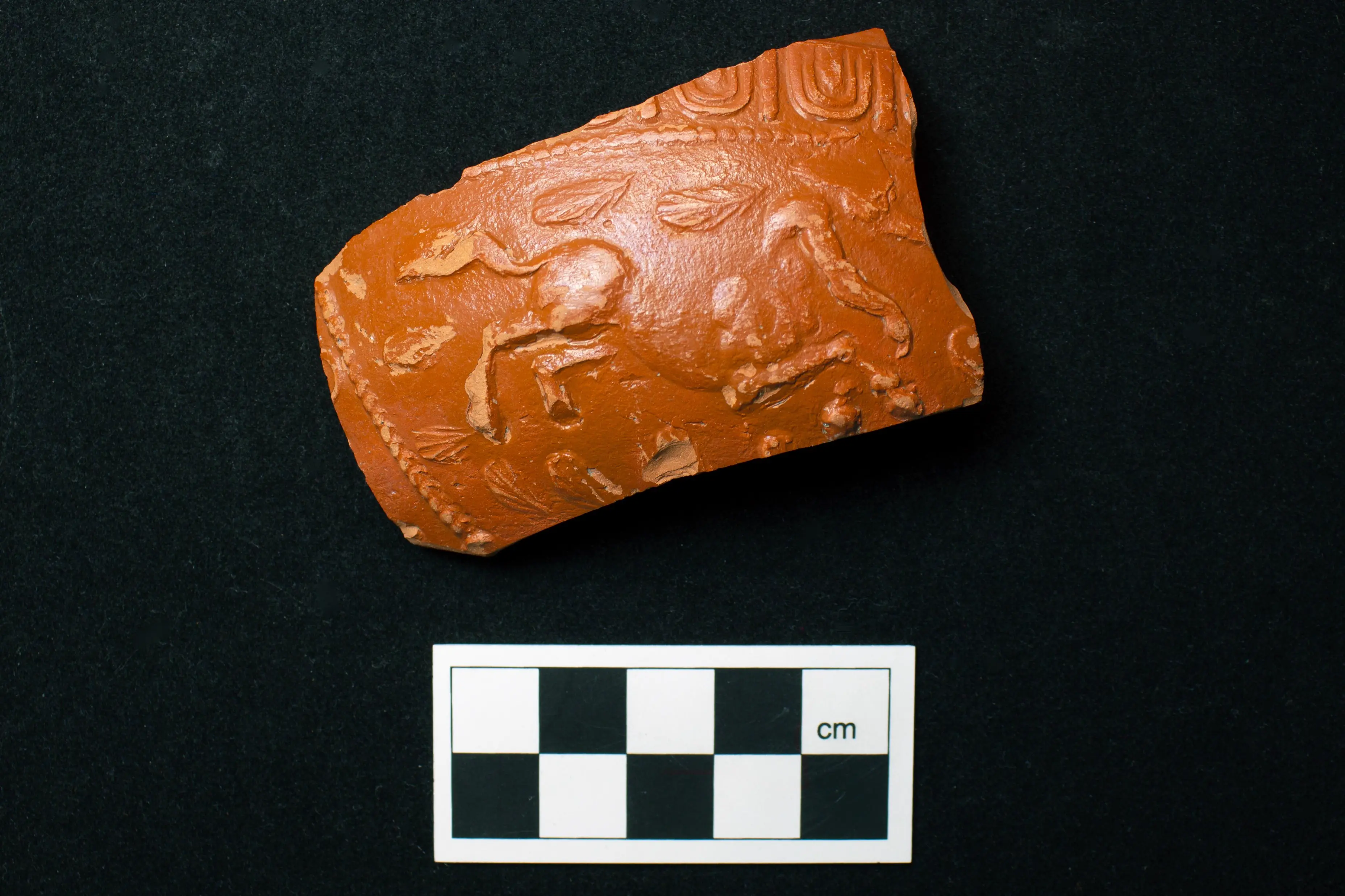 Single decorated Roman pottery sherd with a raised horse motif from Grove