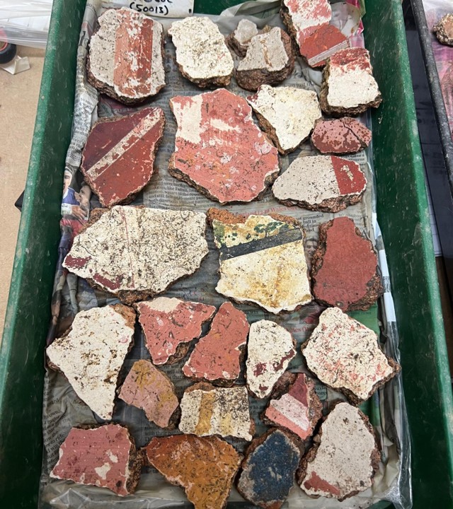 Close detail of coloured Roman wall plaster from Grove villa