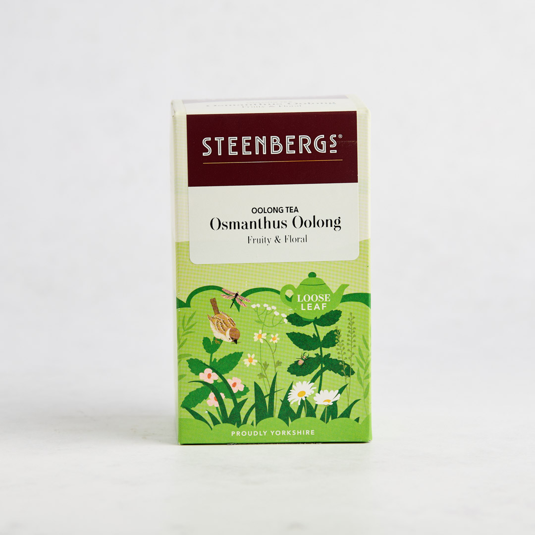 Front of box for Steenbergs Osmanthus Oolong tea. Wren with countryside view illustrated.