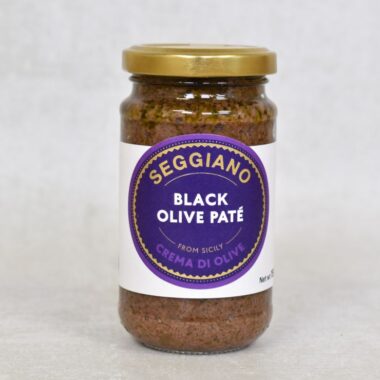 Front view of Seggiano Black Olive Pate, glass jar, with label and gold lid.